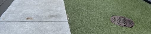 an artificial lawn on the side of a building