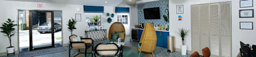 Rent an apartments in Lakeland, FL at Watermarc Apartments - leasing office with Spanish-inspired tile floor and sitting area next to a coffee bar.