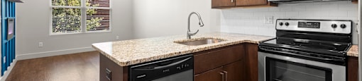 State Street Flats, city side flats apartments, kitchen with a stove, oven, dishwasher, and microwave.