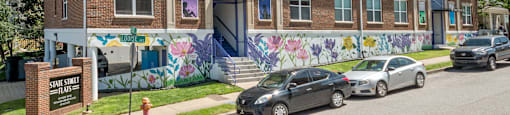 Nashville Tn apartments West End - State Street Flats Apartments brick building with a mural on the side and a sign that says