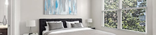 State Street Flats apts for rent Nashville TN bedroom with a large bed and a ceiling fan.