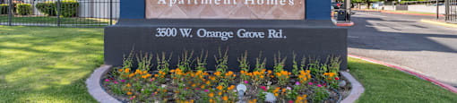 cantera community sign with lush landscape
