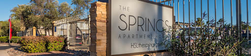 The Springs community sign with nice flowers planted all around