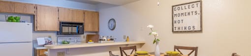 Ridgepointe dining are with ceiling fan and nice lighting