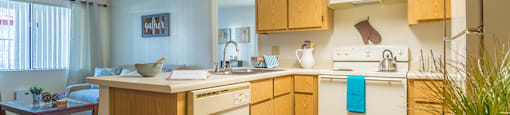 Canyon creek spacious kitchen with plenty of cabinetry, a fridge, and a stove