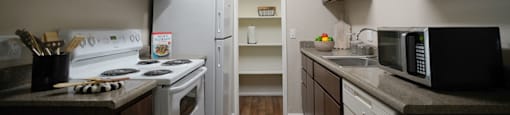 A kitchen with a white stove and white refrigerator.