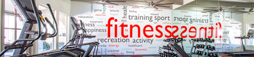 Luxury apartment fitness center with modern equipment.