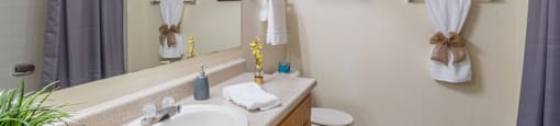 Estancia bathroom with nice bath and sink with drawers