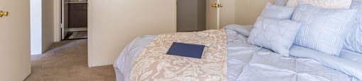 The Springs bedroom with nice natural lighting and carpet flooring