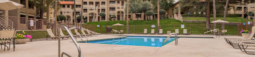 Foothills view of hot tub and spa with relaxation area and grassy area near