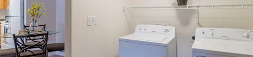 Desert Sands laundry room with standard washer and dryer.