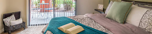 Ridgepointe large bedroom with glass doors and access to patios and balconies