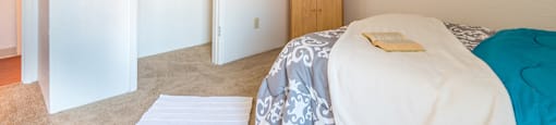 Somerpointe bedroom with large closet and carpet flooring