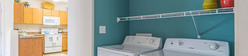 Desert Sands laundry room with a standard washer and dryer.