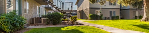 The Springs outside view of apartments with nice lush landscape