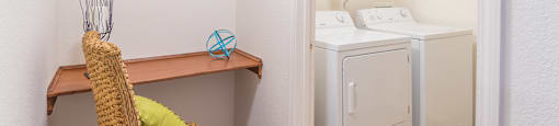 Desert Sands laundry room with standard washer and dryer.