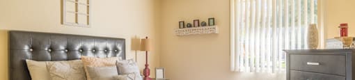 The Springs bedroom with nice natural lighting and carpet flooring