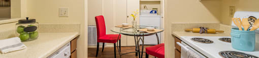Enclave spacious kitchen with plenty of cabinetry, a fridge, a dishwasher, and a oven