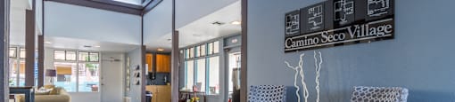 clubhouse with skylights and tall ceilings, windows and modern furniture