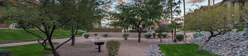 Enclave at the Foothills BBQ Area with decorative gravel and grass landscape.