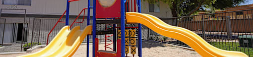 A yellow slide with a red and white circle on it.