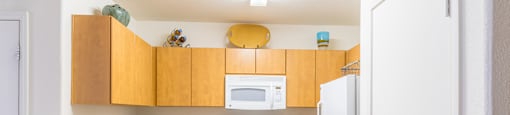 Desert Sands kitchen with all white appliances.