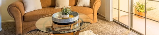 El Encanto spacious living room with sliding glass doors and plenty of natural light