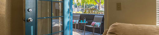 Estancia living rooms with glass doors and private balconies