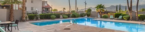 Camino Seco Village pool and hot tub with lounge area