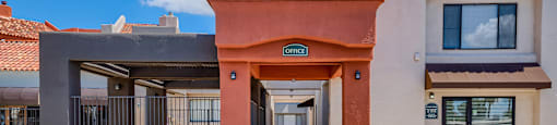 a building with a porch and a street in front of it