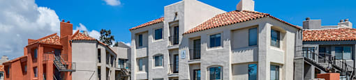 a building with a sign that reads old olympic boulevard on a street