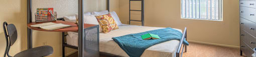 Enclave spacious bedroom with bed and bunk bed