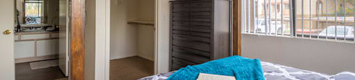 Cantera spacious master bedroom with bathrooms and nice natural lighting