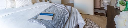 villas at Montebella bedroom with with nice natural lighting, carpet flooring and spacious closets