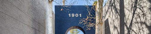 A blue archway with the number 1901 on it.