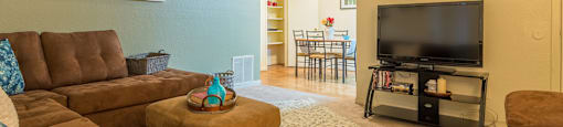 Somerpointe living room with plenty of couches and lounging space with carpet flooring
