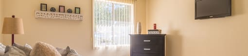 The Springs bedroom with nice natural lighting and carpet flooring