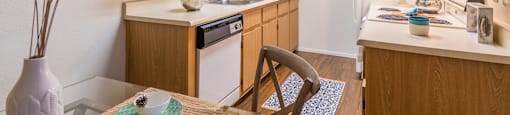 Cantera spacious kitchen with plenty of cabinetry and wood flooring