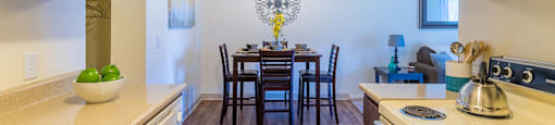 The Srpings view of kitchen and dining area with wood flooring
