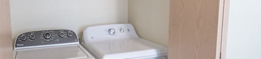 a small laundry room with a washer and dryer