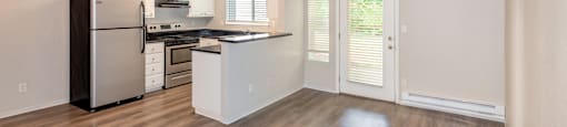 a kitchen and living room in a 555 waverly unit