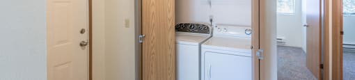 a laundry room with a washer and dryer