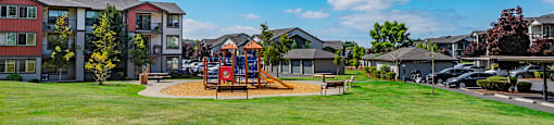the preserve at ballantyne commons park with playground and apartment buildings