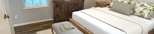 a bedroom with a large bed and a ceiling fan at The Junction, Memphis
