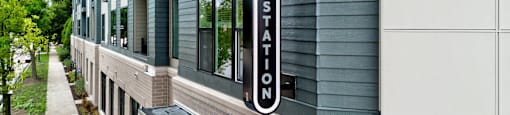 Kelly Station is a modern building with a green and white exterior.