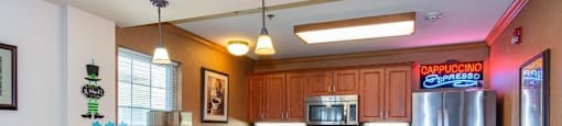 Kitchen in community room with coffee area