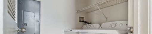 a washer and dryer in a laundry room with a door at Monterey Place, New Haven, CT