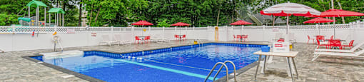 Community Swimming Pool with chairs For Resident Usage at Station Pointe Apartments, Mansfield, MA, 02048