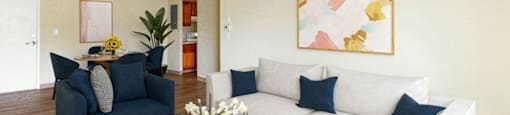 A living room with a blue couch and a white couch at Edmands House, Massachusetts, 01701