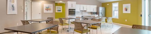 Community room with tables and chairs at Station Pointe Apartments, Mansfield, MA, 02048